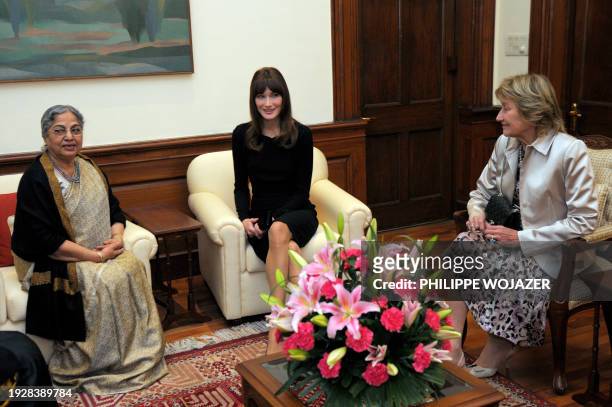 Indian Prime Minister Manmohan Singh's wife Gursharan Kaur , French First Lady Carla Bruni-Sarkozy and her mother Marisa Bruni-Tedeschi pose prior to...