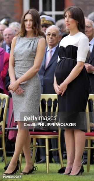 French First lady Carla Bruni-Sarkozy and British Samantha Cameron attend a ceremony at the Royal Hospital Chelsea in London on June 18, 2010 to...