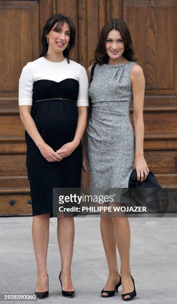 British Samantha Cameron welcomes French First lady Carla Bruni-Sarkozy at the Royal Hospital Chelsea in London on June 18 before attending a...