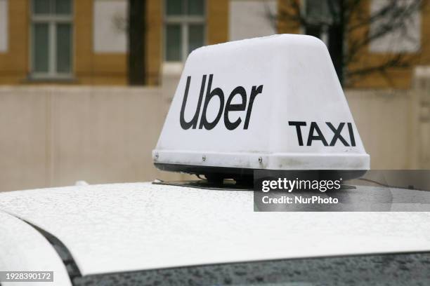 The Uber logo is seen in the rain in Krakow, Poland, on January 6, 2024.