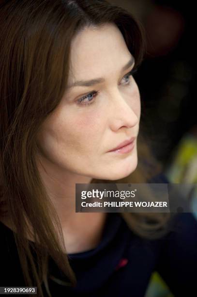 French First Lady Carla Bruni-Sarkozy attends an AIDS World fund meeting in Ouagadougou on February 11, 2009. Bruni-Sarkozy was on a 24-hour visit in...