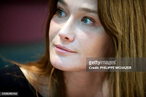 French first Lady Carla Bruni-Sarkozy attends an AIDS World fund meeting in Ouagadougou on February 11, 2009. Bruni-Sarkozy was in Burkina Faso on...