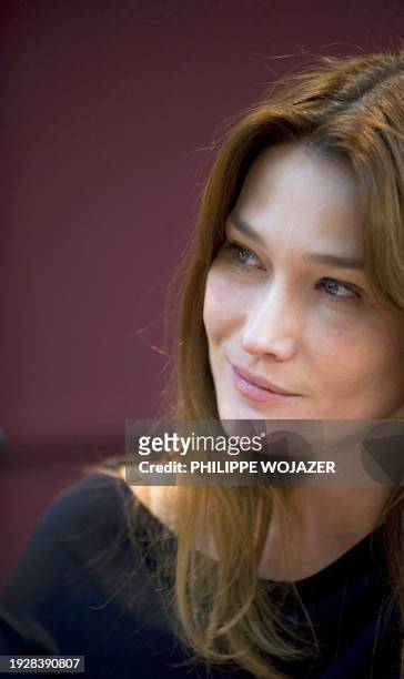 French First Lady Carla Bruni-Sarkozy attends an AIDS World fund meeting in Ouagadougou on February 11, 2009. Bruni-Sarkozy was on a 24-hour visit in...