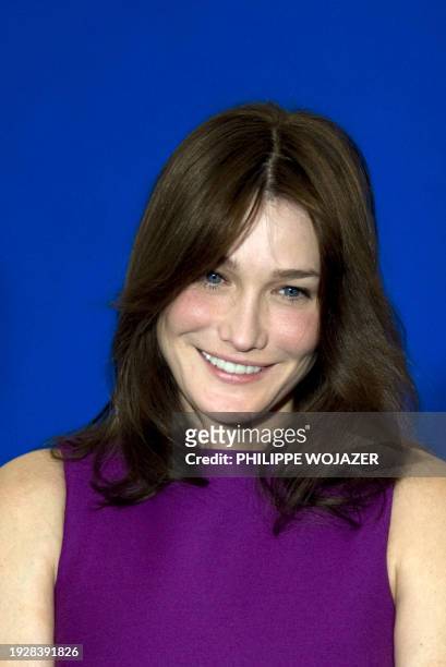 France's First Lady Carla Bruni-Sarkozy attends a speech delivered by her husband French president Nicolas Sarkozy at a meeting of the French...