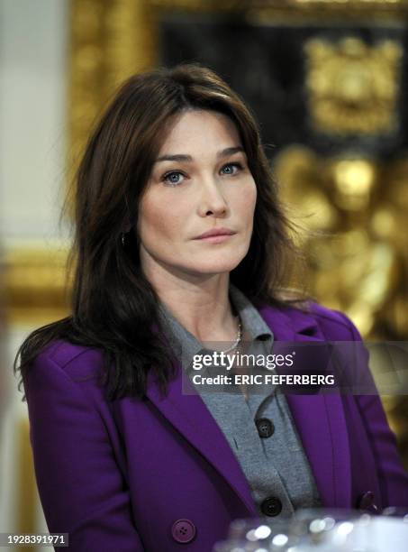 French First Lady Carla Bruni-Sarkozy attends a lunch with British Prime minister's wife Sarah Brown on March 27, 2008 in Lancaster House, London....