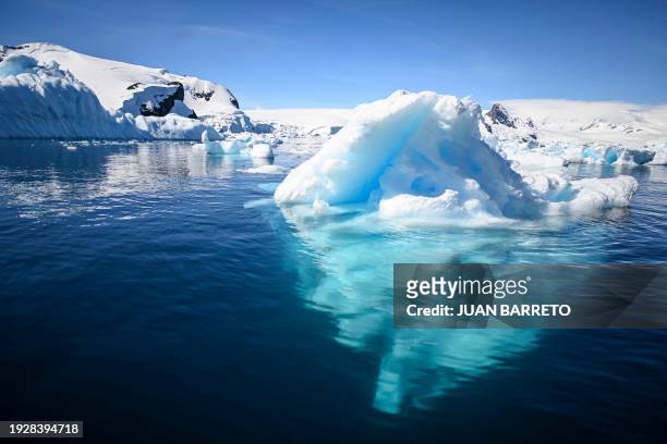 View of an iceberg at the Gerlache Strait -which separates the Palmer Archipelago from the Antarctic Peninsula, on January 15, 2024. Scientists and...
