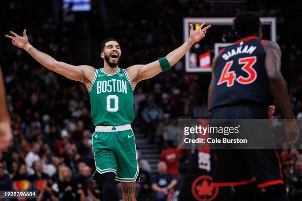Jayson Tatum of the Boston Celtics reacts to a team basket against the Toronto Raptors during the first half of their NBA game at Scotiabank Arena on...