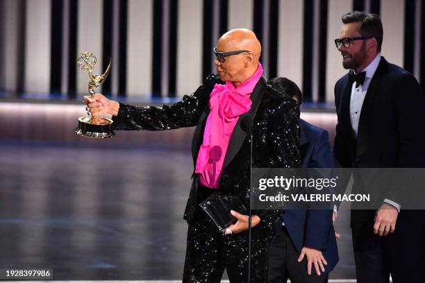 Outstanding Reality TV Competition winner RuPaul for "RuPaul's Drag Race" holds his award onstage during the 75th Emmy Awards at the Peacock Theatre...