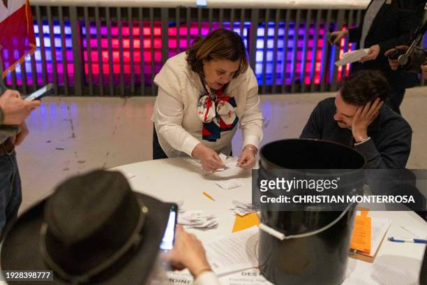 Caucus captains tally the votes during the Republican Iowa caucus at Franklin Jr. High School in Des Moines, Iowa, on January 15, 2024. Republican...