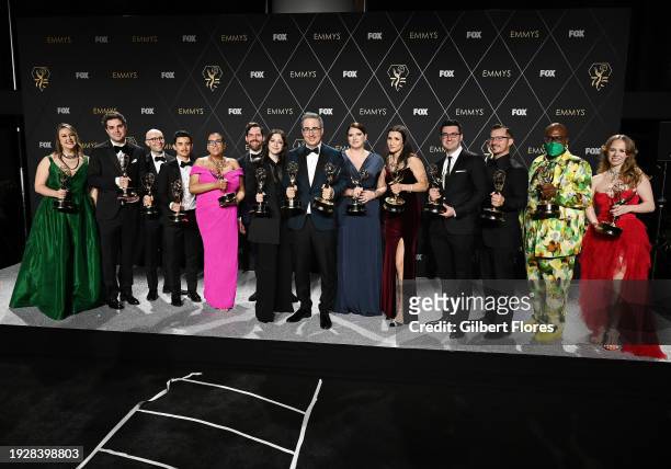 John Oliver and winners of Outstanding Writing For A Variety Series for "Last Week Tonight With John Oliver" pose in the press room at the 75th...