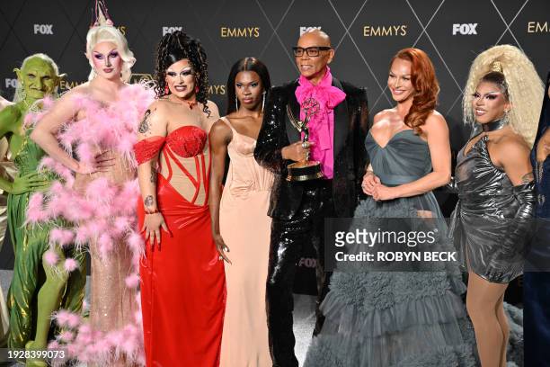 Outstanding Reality TV Competition Program winner RuPaul for "RuPaul's Drag Race" poses in the press room with Drag performers during the 75th Emmy...