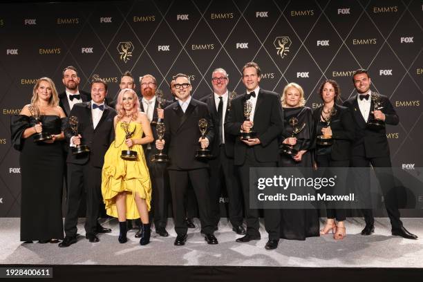 Los Angeles, CA British filmmaker David Furnish and Luke Lloyd-Davies pose in the press room with the Outstanding Variety Special award for "Elton...