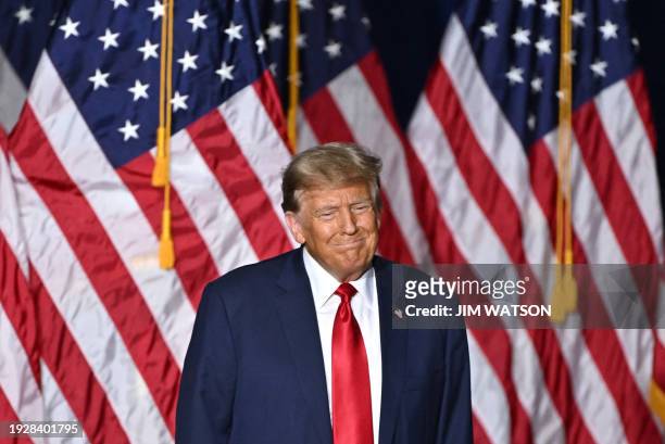Former US President and Republican presidential hopeful Donald Trump attends a watch party during the 2024 Iowa Republican presidential caucuses in...