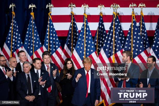 Former US President Donald Trump, third right, departs following a caucus night watch party in Des Moines, Iowa, US, on Monday, Jan. 15, 2024. Trump...