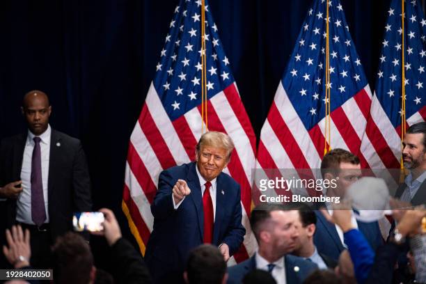 Former US President Donald Trump, center left, departs following a caucus night watch party in Des Moines, Iowa, US, on Monday, Jan. 15, 2024. Trump...