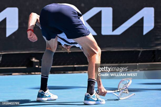 Kazakhstan's Alexander Bublik smashes his racquet after a point against India's Sumit Nagal during their men's singles match on day three of the...