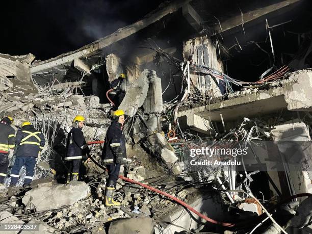 Teams carry out search and rescue operations after unmanned aerial vehicle attacks in Erbil, Iraq on January 16, 2024. Several explosions were...