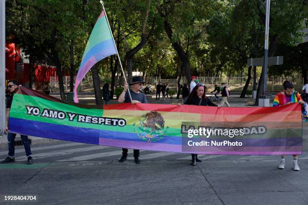 Members of the LGBTTTIQA community are holding flags and banners as they block Avenida de los Insurgentes and Avenida Paseo de la Reforma in Mexico...