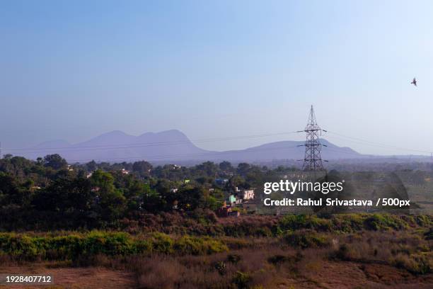 scenic view of field against clear sky,jamshedpur,jharkhand,india - jharkhand stockfoto's en -beelden