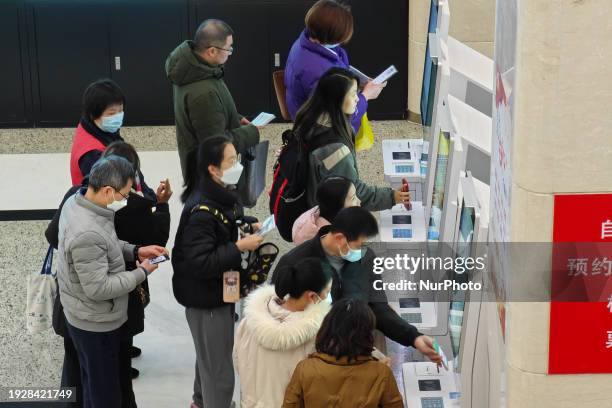 Patients are making appointments, paying fees, and collecting medicine at a hospital in Shanghai, China, on January 16, 2024.