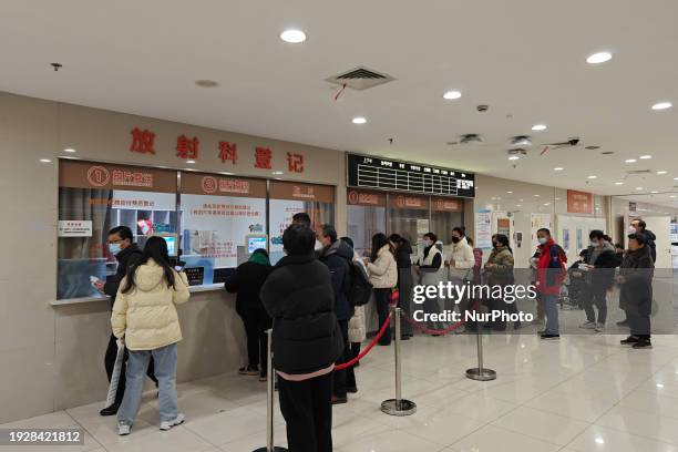 Patients are making appointments, paying fees, and collecting medicine at a hospital in Shanghai, China, on January 16, 2024.