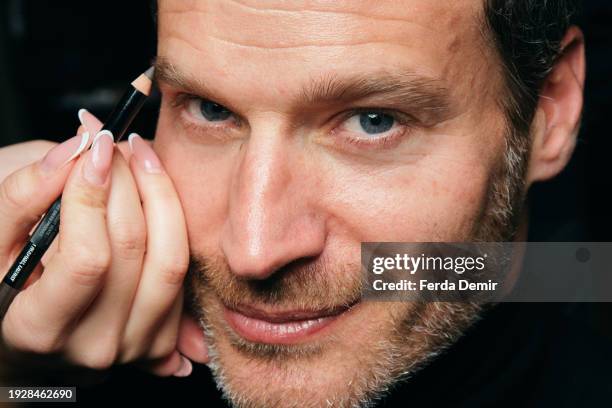 Model poses backstage at the Billionaire fashion show during the Milan Menswear Fall/Winter 2024-2025 on January 12, 2024 in Milan, Italy.