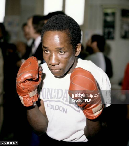 Zambian flyweight boxer Patrick Mambwe poses for a portrait with his gloves in London, England, October 31, 1978.