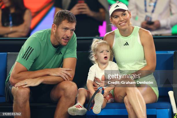 Caroline Wozniacki of Denmark sits alongside her husband David Lee and daughter Olivia during the Kids Tennis Day Arena Spectacular ahead of the 2024...