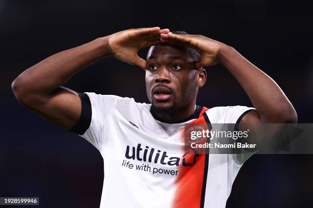 Teden Mengi of Luton Town celebrates with the fans during the Premier League match between Burnley FC and Luton Town at Turf Moor on January 12, 2024...