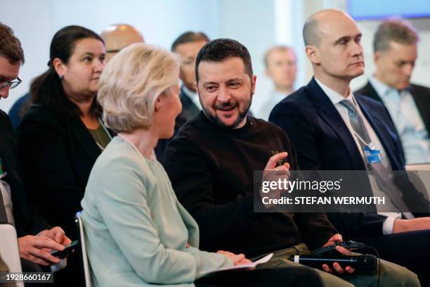 Ukrainian President Volodymyr Zelensky speaks with European Commission President Ursula Von der Leyen at a session with 'CEOs for Ukraine' during the...