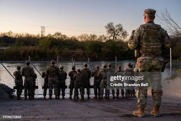 National Guard soldiers stand guard on the banks of the Rio Grande river at Shelby Park on January 12, 2024 in Eagle Pass, Texas. The Texas National...