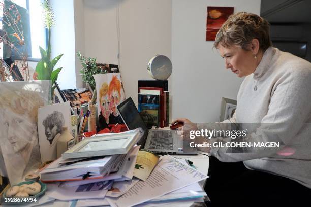 Iris Haim, the mother of hostage Yotam Haim, who was killed mistakly by Israeli soldiers a month ago in the Gaza strip, sits at her desk during an...