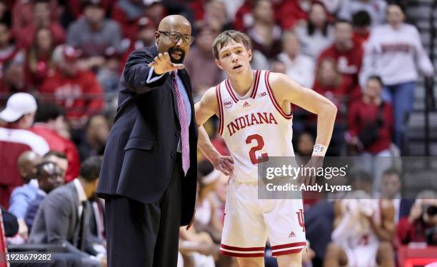 Mike Woodson the head coach of the Indiana Hoosiers gives instructions to Gabe Cupps during the game against the Minnesota Golden Gophers at Simon...