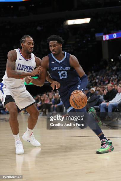 Jaren Jackson Jr. #13 of the Memphis Grizzlies drives to the basket against Kawhi Leonard of the LA Clippers during the first half at FedExForum on...