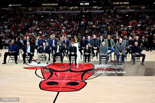 The former players, coaches and managers look on during the inaugural Ring of Honor ceremony for the 1995-1996 Chicago Bulls at the game between...
