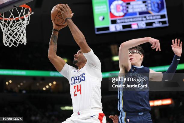 Norman Powell of the LA Clippers goes to the basket against Jake LaRavia of the Memphis Grizzlies during the second half at FedExForum on January 12,...