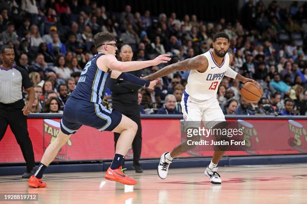 Paul George of the LA Clippers handles the ball against Jake LaRavia of the Memphis Grizzlies during the second half at FedExForum on January 12,...