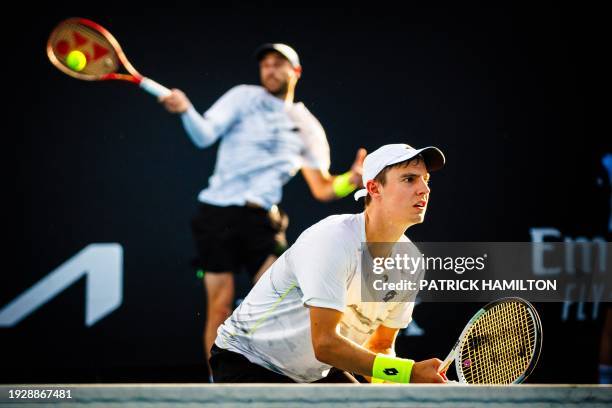 Joran Vliegen and Sander Gille pictured in action during a doubles tennis match between Belgian pair Gille-Vliegen and Czech-Chinese pair...