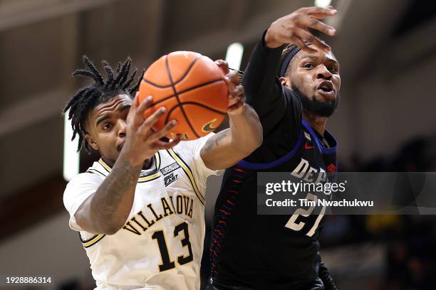 Hakim Hart of the Villanova Wildcats reaches for a rebound past Da'Sean Nelson of the DePaul Blue Demons during the second half at Finneran Pavilion...