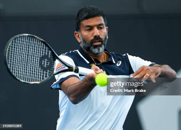 Rohan Bopanna of India hits a forehand during their match against Rajeev Ram of the USA and Joe Salisbury of Great Britain in the 2024 Adelaide...