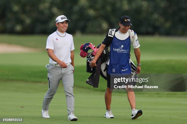 Taiga Semikawa of Japan and his caddie walks the third fairway during the second round of the Sony Open in Hawaii at Waialae Country Club on January...