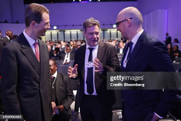 Robert Habeck, Germany's economy and climate minister, center, speaks with attendees ahead of a special address on the opening day of the World...