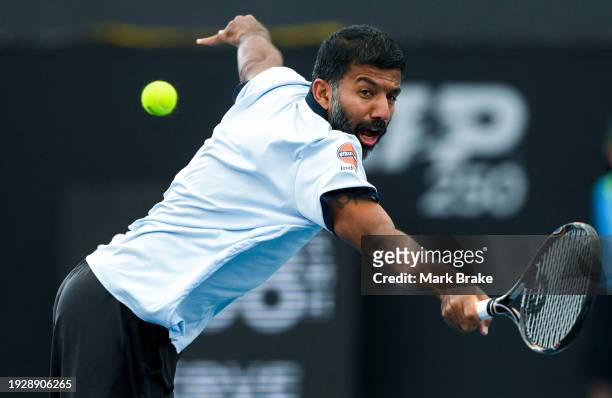 Rohan Bopanna of India plays a back hand during their match against Rajeev Ram of the USA and Joe Salisbury of Great Britain in the 2024 Adelaide...