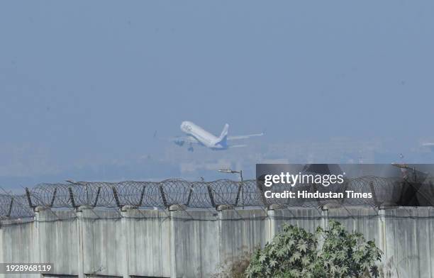 Passenger plane takes off from the runway at IGI T3 Terminal in the morning winter fog, on January 15, 2024 in New Delhi, India. Foggy morning...