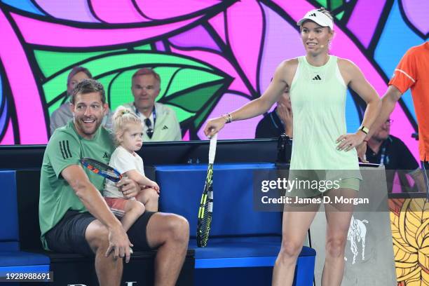 Caroline Wozniacki of Denmark sits with husband David Lee and daughter Olivia Lee during the Kids Tennis Day Arena Spectacular ahead of the 2024...