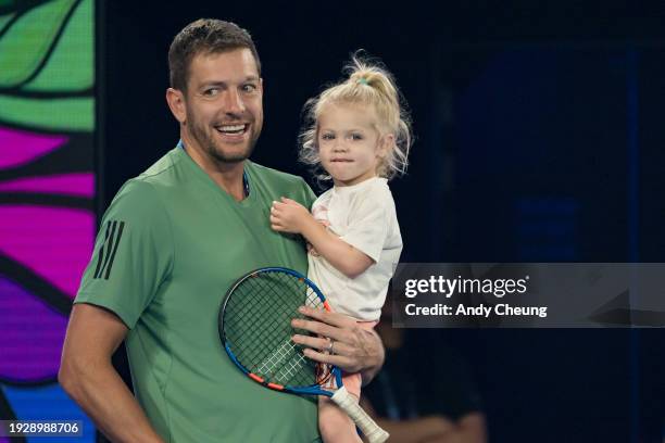 Caroline Wozniacki's husband and daughter, David Lee and Olivia Lee look on during the Kids Tennis Day Arena Spectacular ahead of the 2024 Australian...