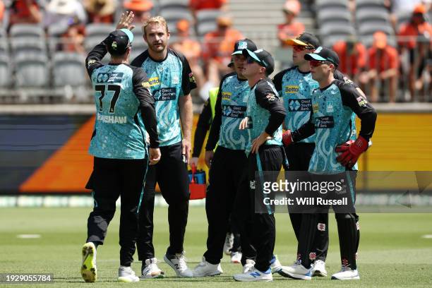 The Heat celebrates after taking the wicket of Laurie Evans of the Scorchers during the BBL match between Perth Scorchers and Brisbane Heat at Optus...