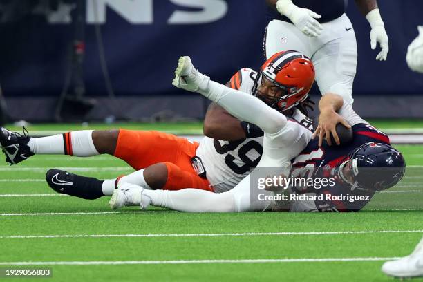 Za'Darius Smith of the Cleveland Browns sacks Case Keenum of the Houston Texans at NRG Stadium on December 24, 2023 in Houston, Texas.