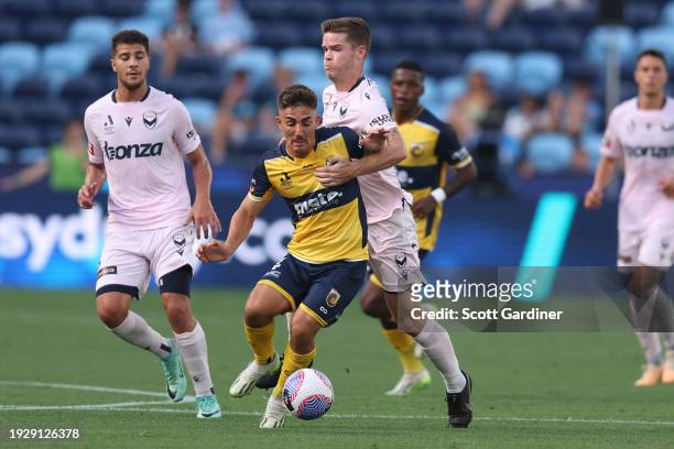 Joshua Nisbet of the Mariners competes for the ball withs Connor Chapman of Melbourne Victory during the A-League Men round 12 match between Central...