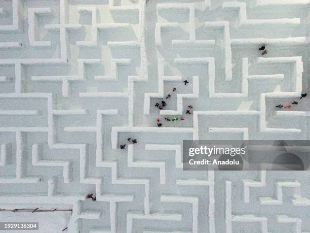 An aerial view of people trying to find the way out in the biggest snow maze in the world in Zakopane, Poland, January 15, 2024. The snow maze idea...